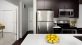 Luxury kitchen with modern finishes, quartz countertops, and stainless-steel appliances.