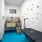 Pet spa with a bet wash station, grooming table, and dog print decals on the walls.