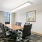 Conference room with 8 meeting chairs and executive table